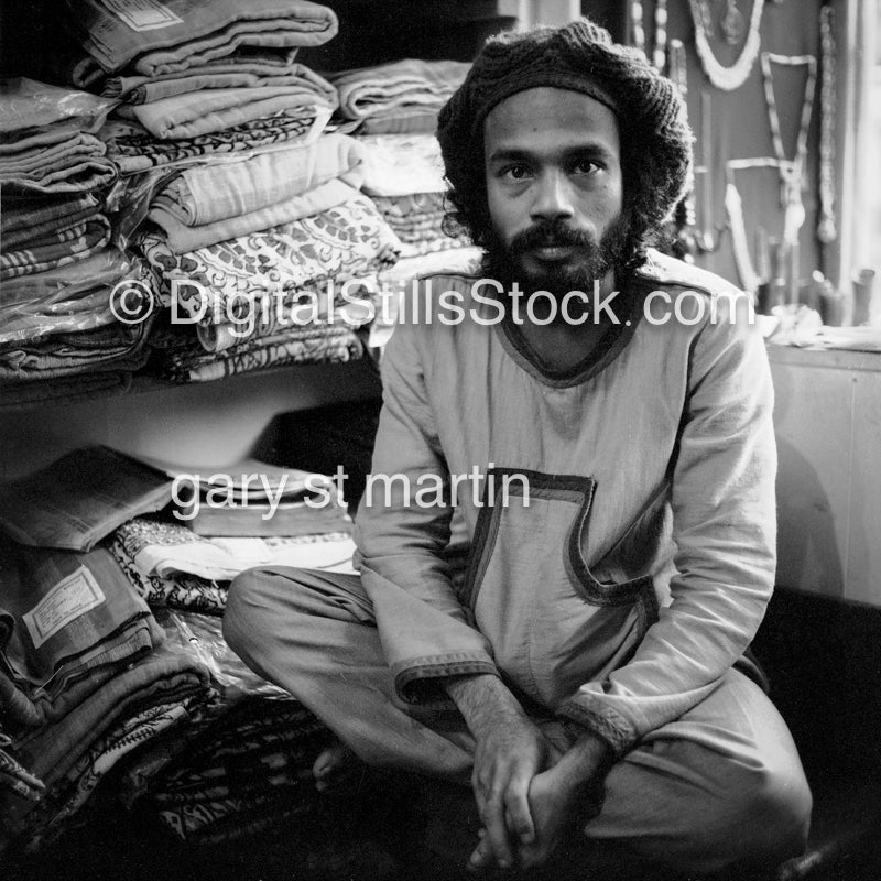 Lazar Sitting by Folded Clothes in Shop, Analog, Portraits, Men, Black and White
