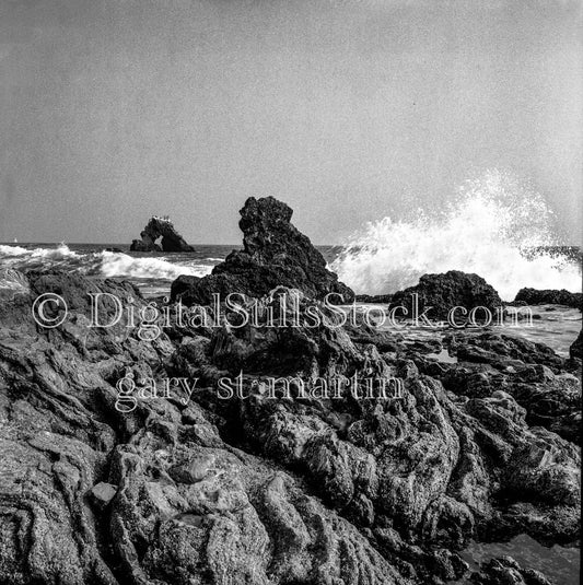 Wave Crash Along Rocky Shore in California