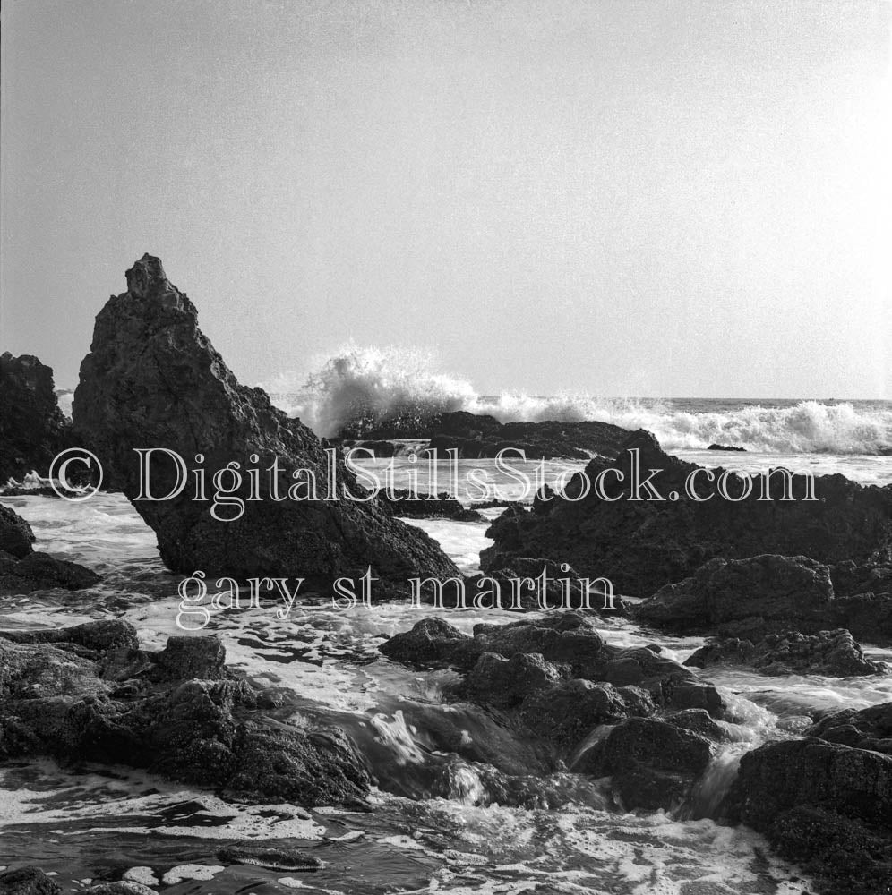 Sea Foam and Waves Approaching Rocky California Shore