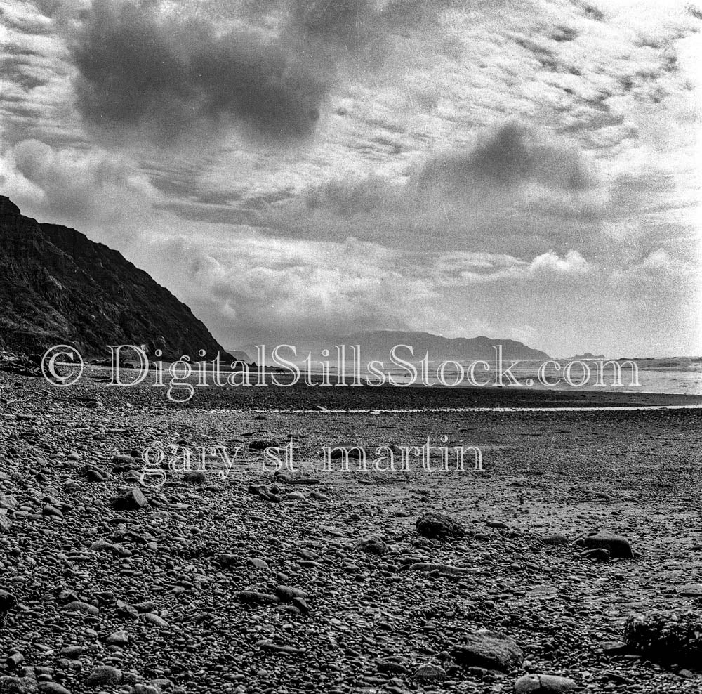 Turbulent Skies Over Rocky Coast