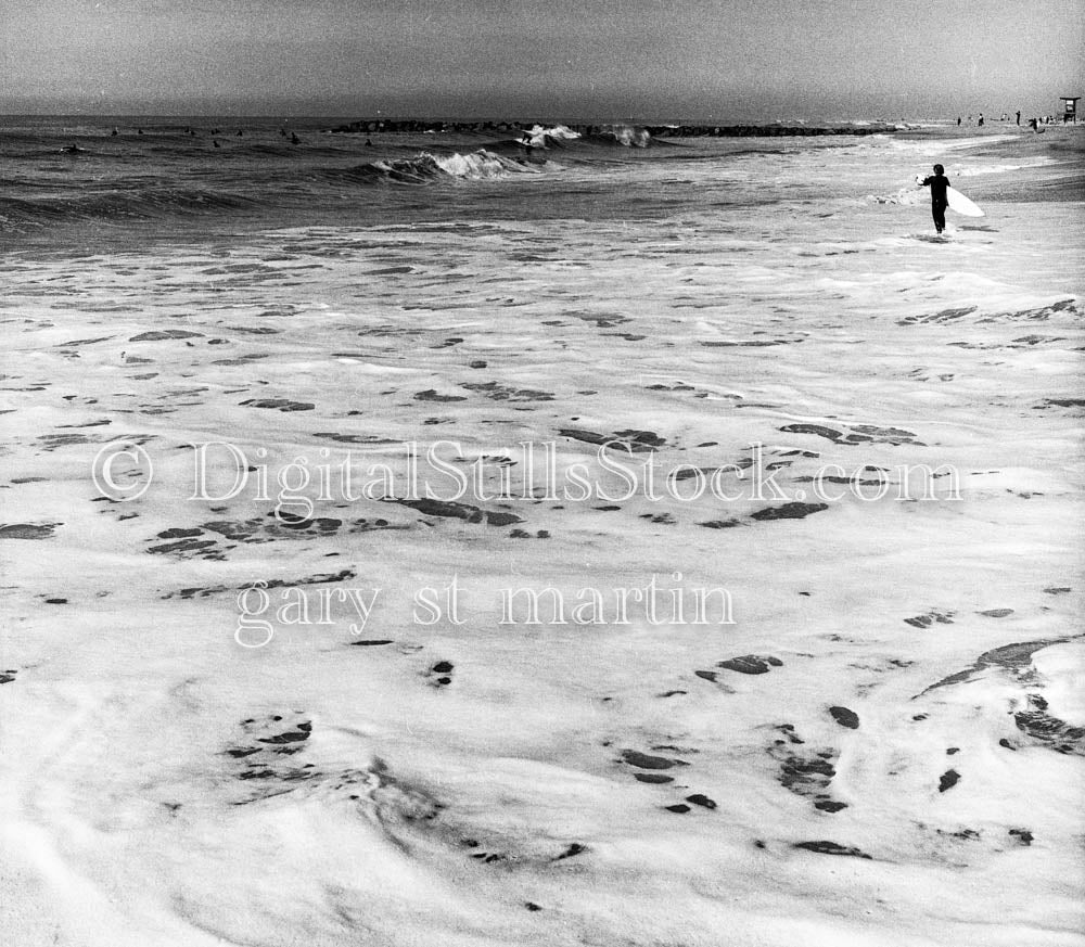 Surfer Running Along Ocean and Sea Foam
