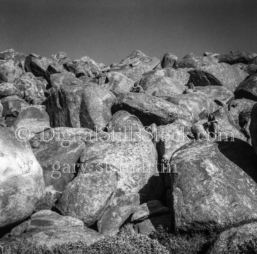 Friends Sitting on Rocks in Palm Springs, California