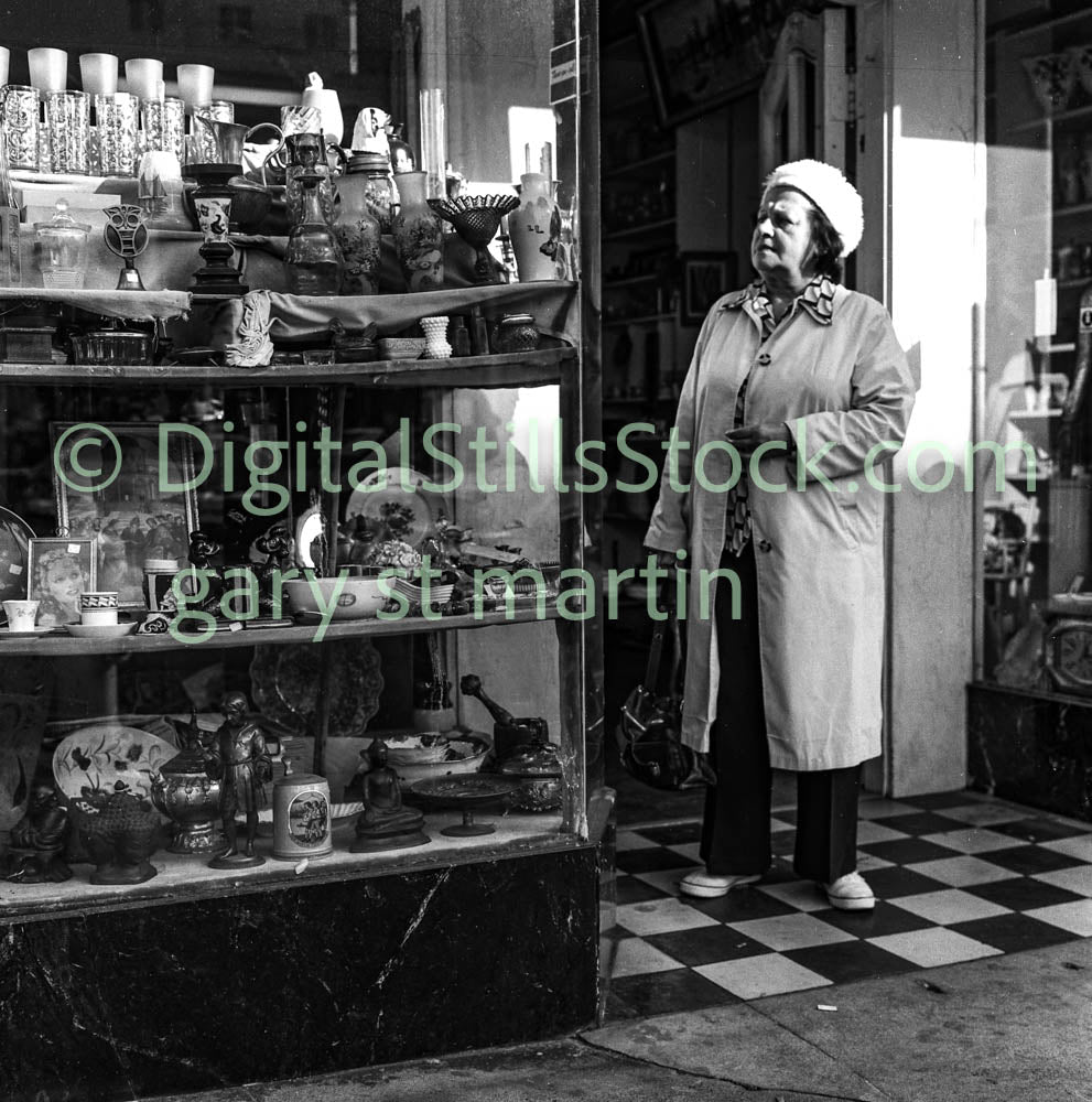 Woman Looking at Glassware, Polk St., Analog, B & W