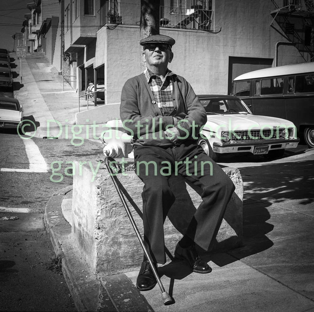 Man with Cane Sitting on Pavement Block, B & W, Analog, Polk St.