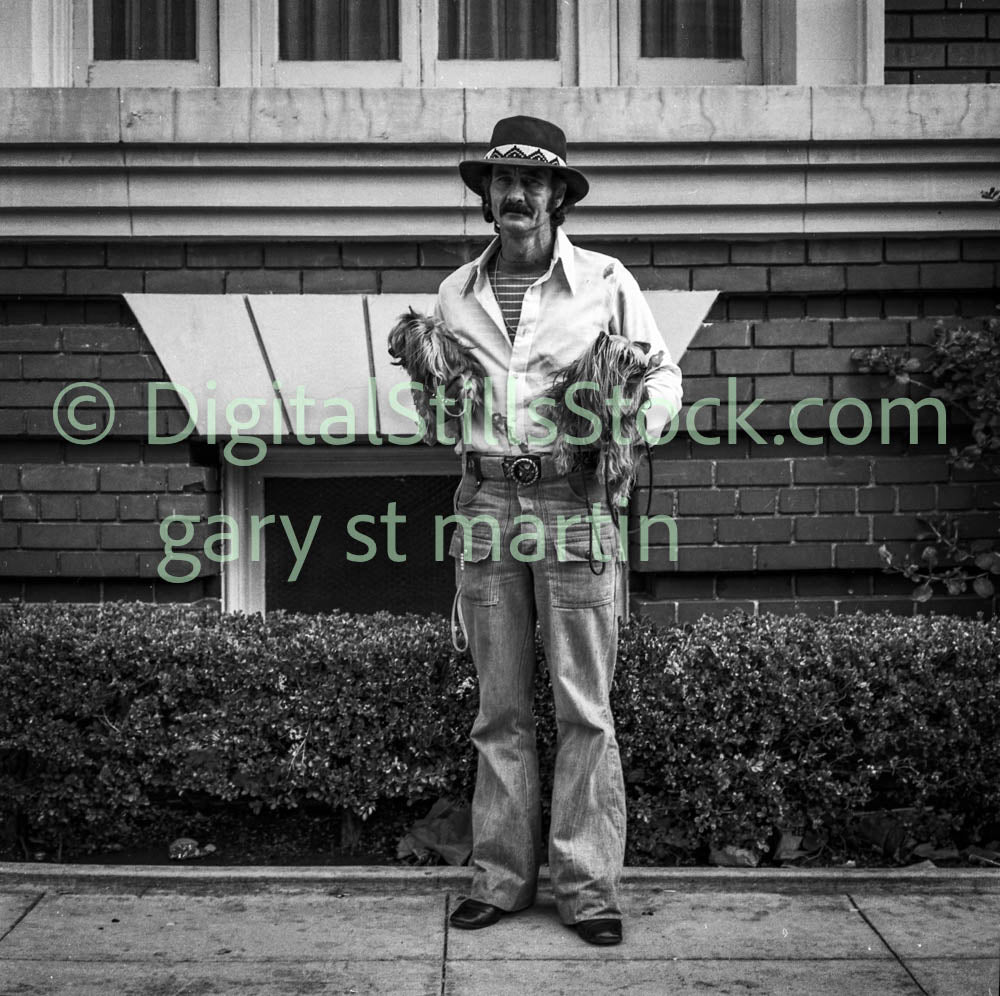 Western Man Holding Two Small Dogs, Polk St., Analog, B & W