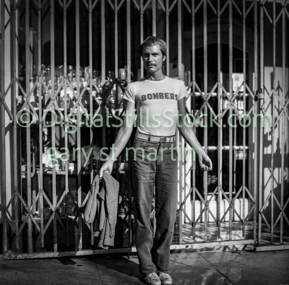 Man Wearing 'Bomber' Tee, Analog, Polk St., B & W