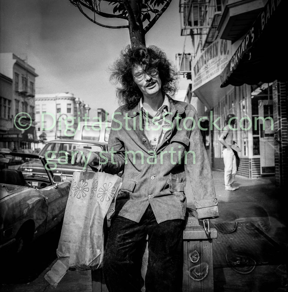 Man with Flower Bag Leaning Against Post, Analog, Polk St., B & W