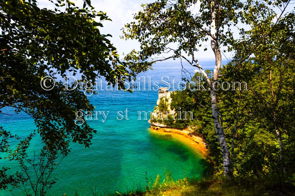 Miner's Castle on the edge of bright turquoise water, digital Munising