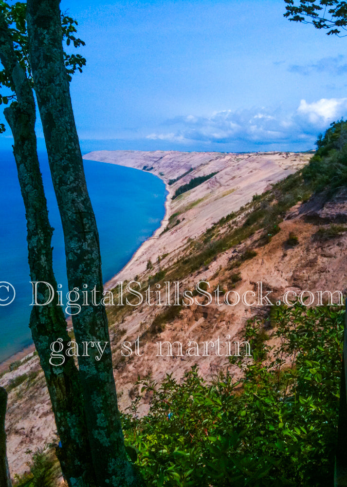 Looking down at the Logslide from behind two trees, digital grand Marais