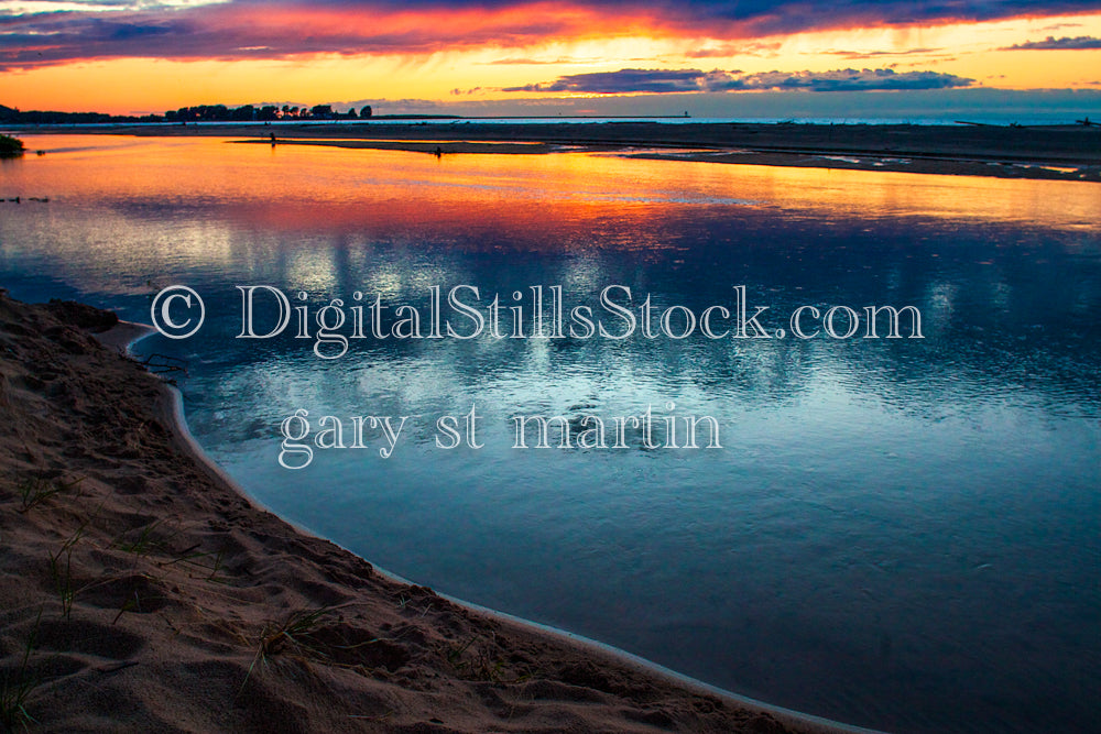 Multi-colored sky reflecting in the calm lake water, digital Grand Marais
