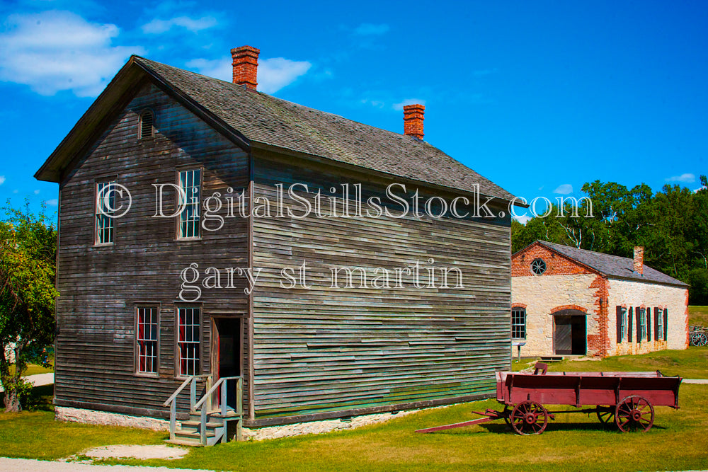 Old Red Wagon in front of Old wooden Buildings in Fayette, digit fayette