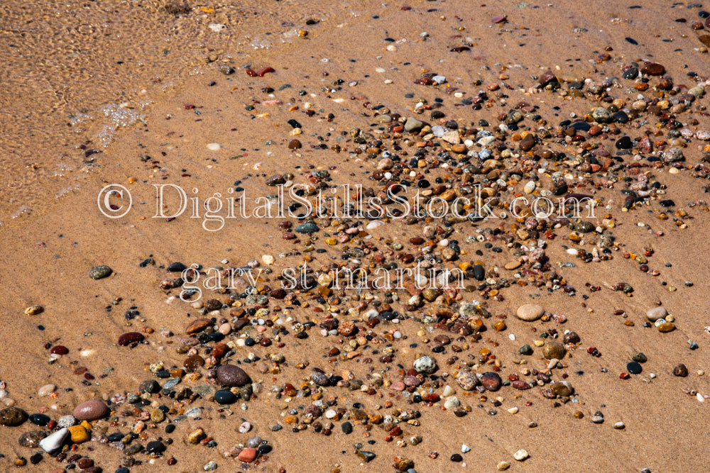 Closeup of small pebbles in the sand, digital grand marais