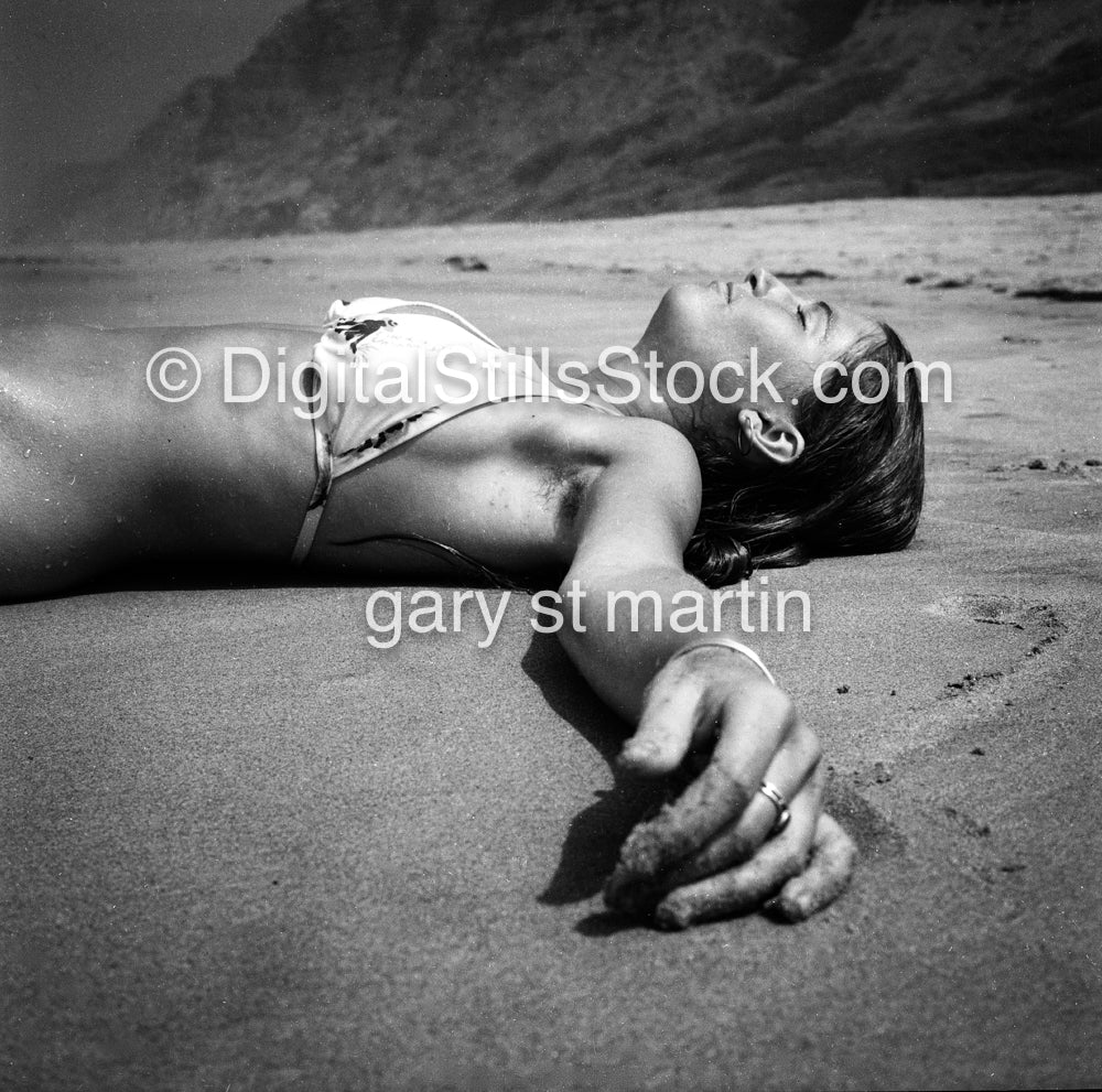 Diane resting in the Sand, analog, black & white, portrait