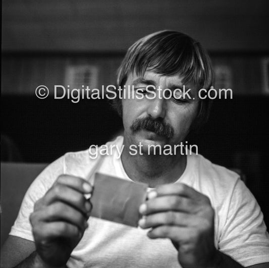 Portrait Of A Man Holding An Object analog, men, black and white,
