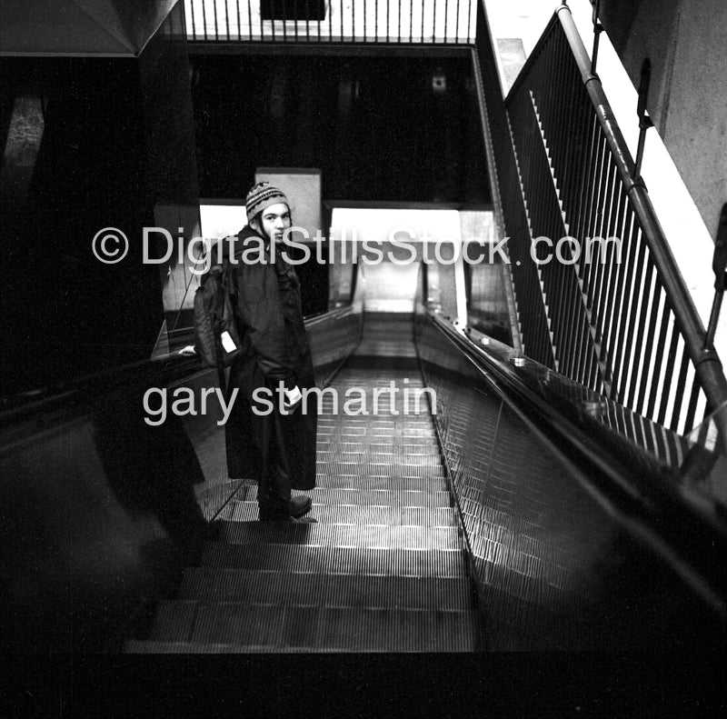 Caroline Down The Escalator, the BART station San Francisco, analog, black & white, portrait