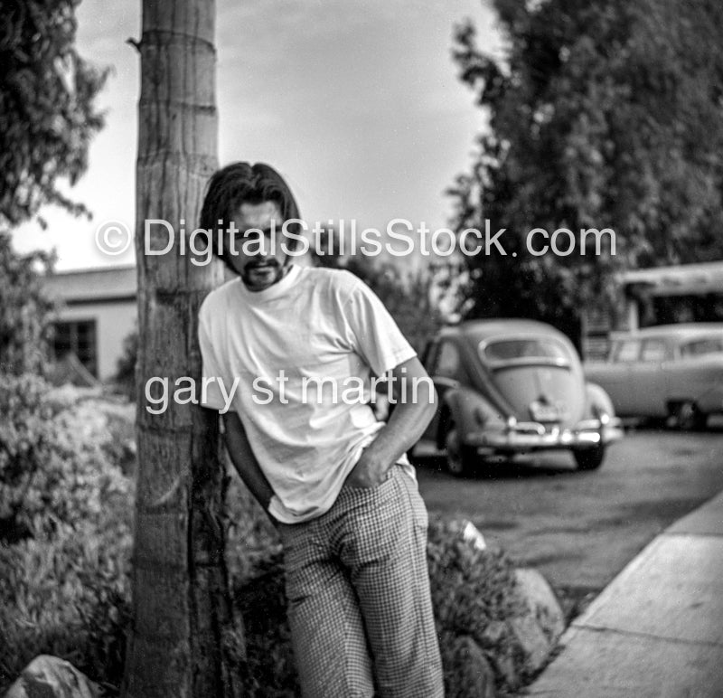 Jim Leaning On A Palm Tree analog, men, black and white,