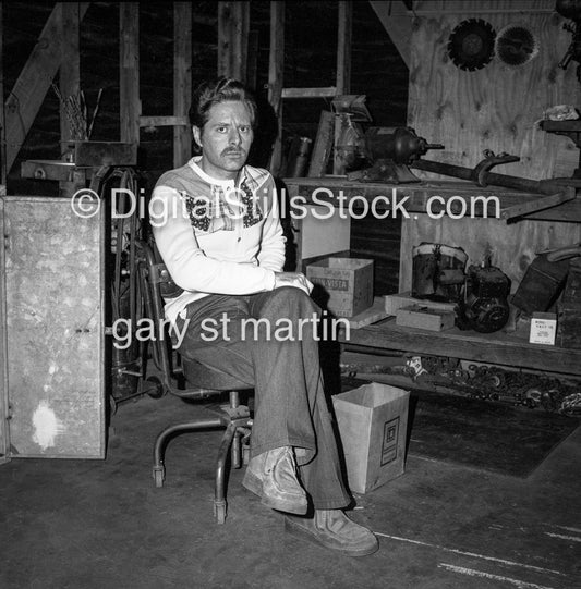 Ricky Sitting In A Tool House Workshop analog, men, black and white,