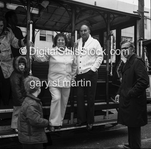 Couple posing on a trolley car, black and white analog groups