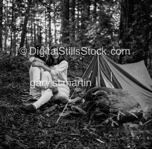 Couple hugging by their tent, black and white analog groups