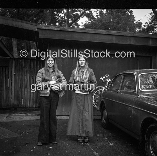 two ladys in a driveway