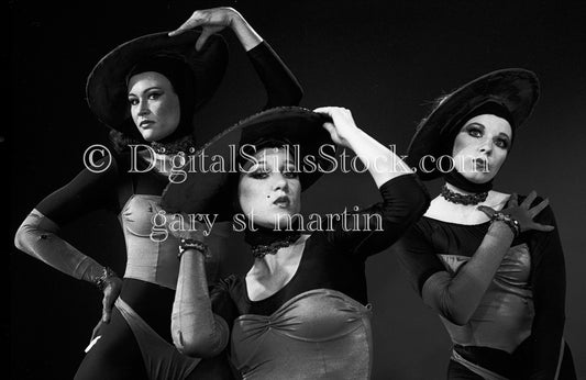 Dansations in dramatic hats, analog black and white