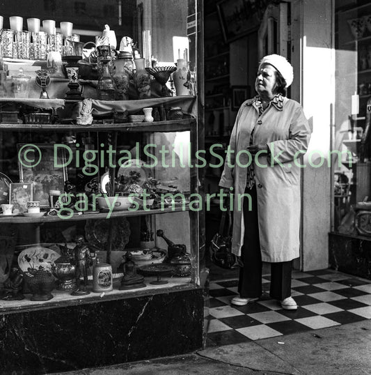 Woman Looking at Glassware, Polk St., Analog, B & W
