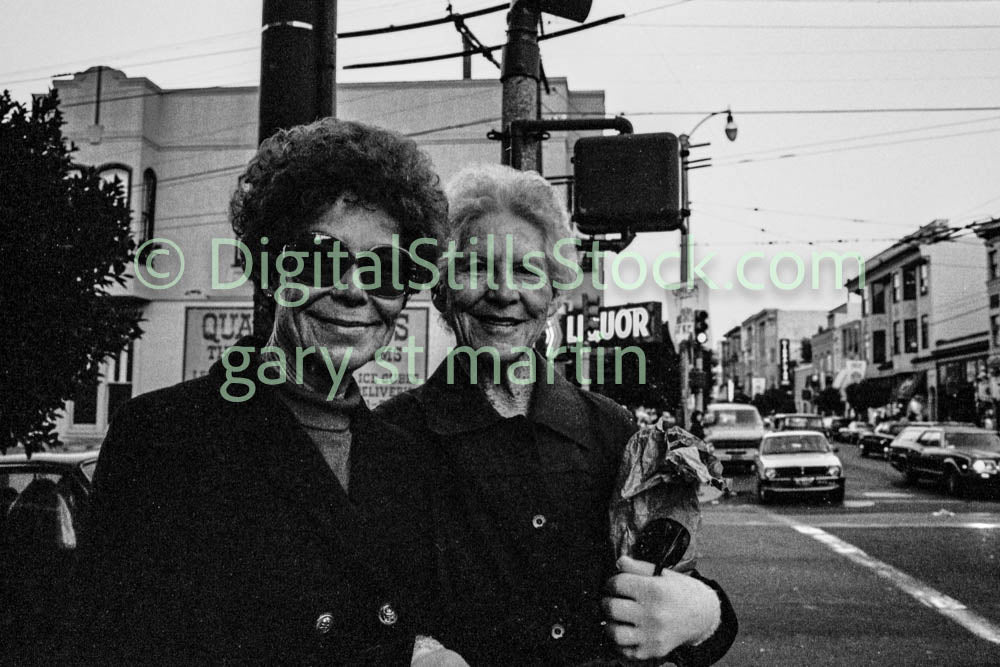 Two Women in Black Jackets Smiling, Analog, Polk St., B & W