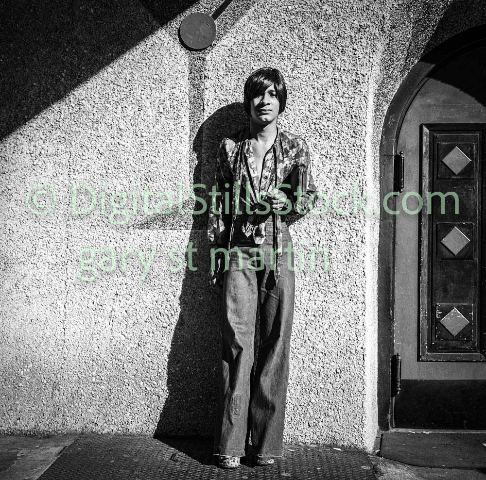 Man in Bellbottoms Leaning Along Wall, Polk St., B & W, Analog