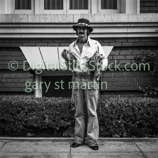 Western Man Holding Two Small Dogs, Polk St., Analog, B & W