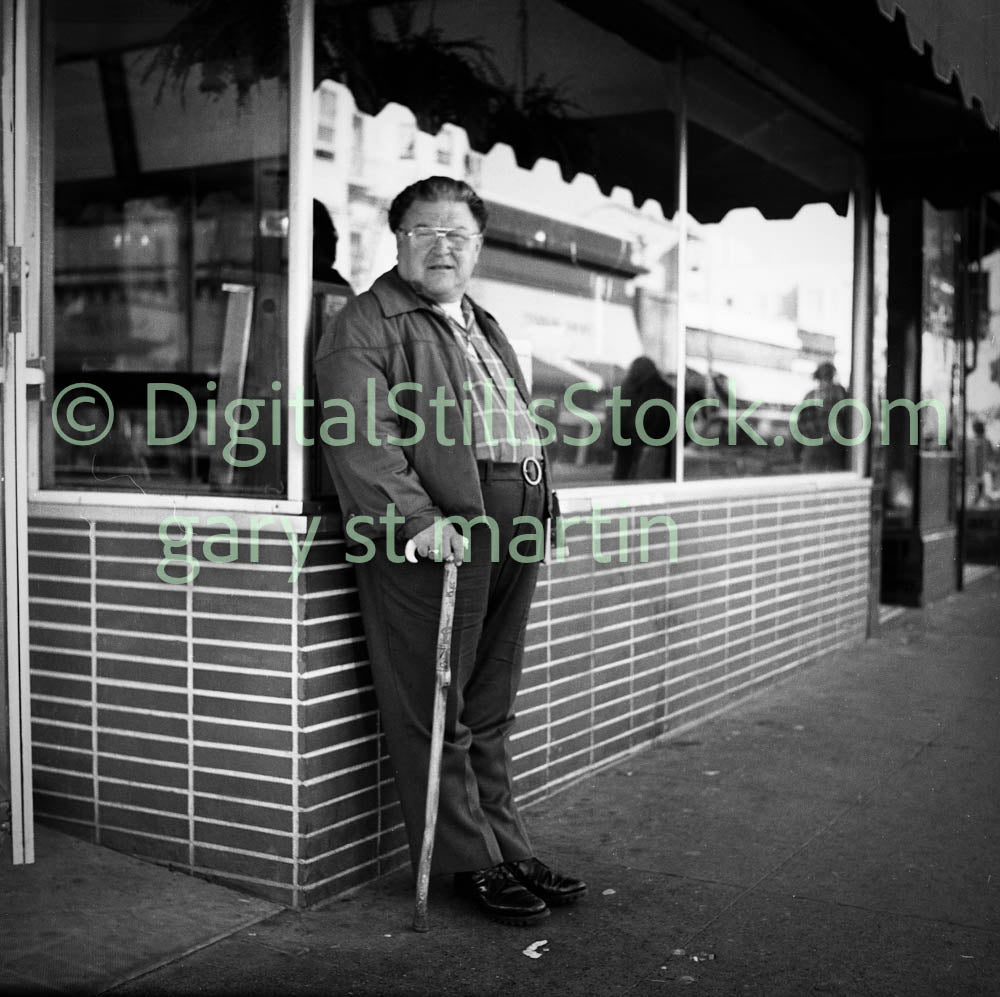 Man with Cane Leaning Along Shop Window, Analog, Polk St., B & W