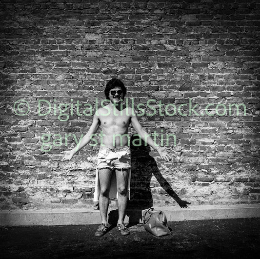 Shirtless Man Leaning on Brick Wall, Analog, Polk St., B & W