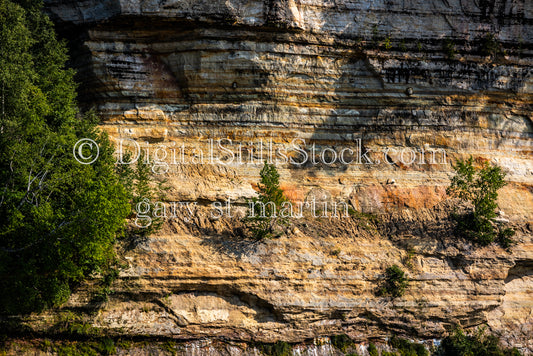 Looking at the different colored layers in the rock, digital Munising