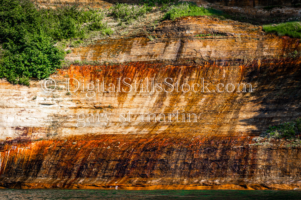 Dark orange colors of the rock, digital Munising