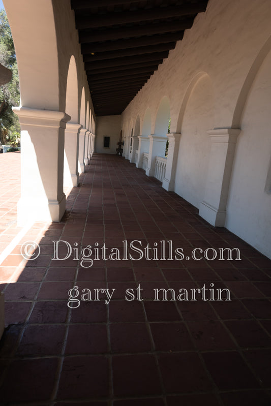 Walkway in between arches in the Junipero Serra Mission, digital Junierpo Serra