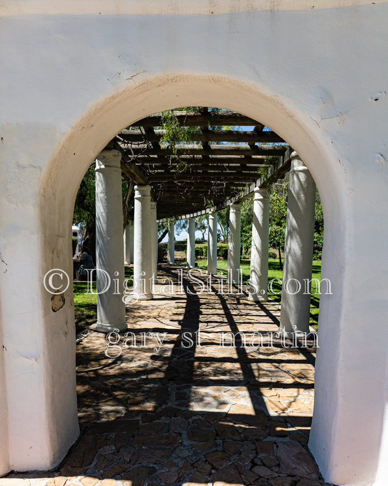 Walking under the archway, digital Junipero Serra