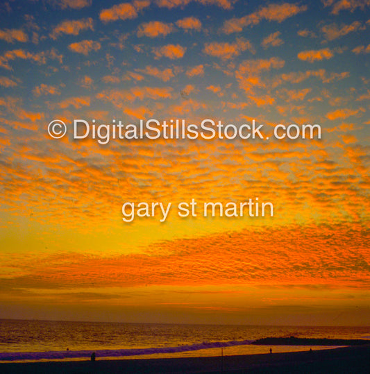 Field of gilded clouds over the beach, analog sunsets