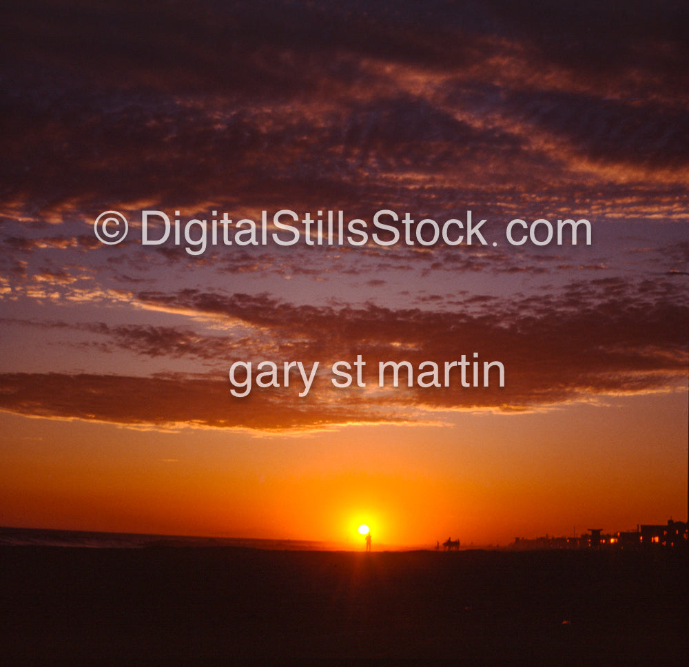 Silhouette of a person in front of the setting sun, analog sunsets