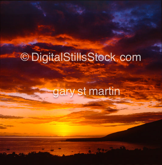 Sunset lighting up the boats in the bay on the Big Island, Hawaii, analog sunsets