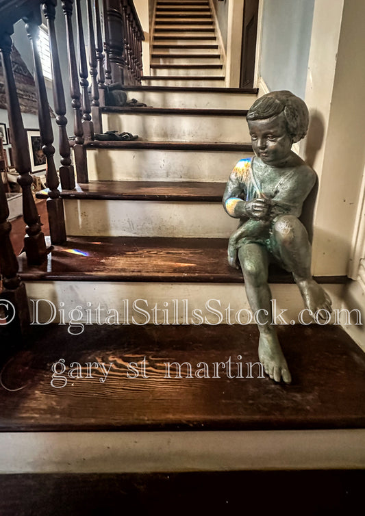 boy figurine on stairs, New Orleans, Digital