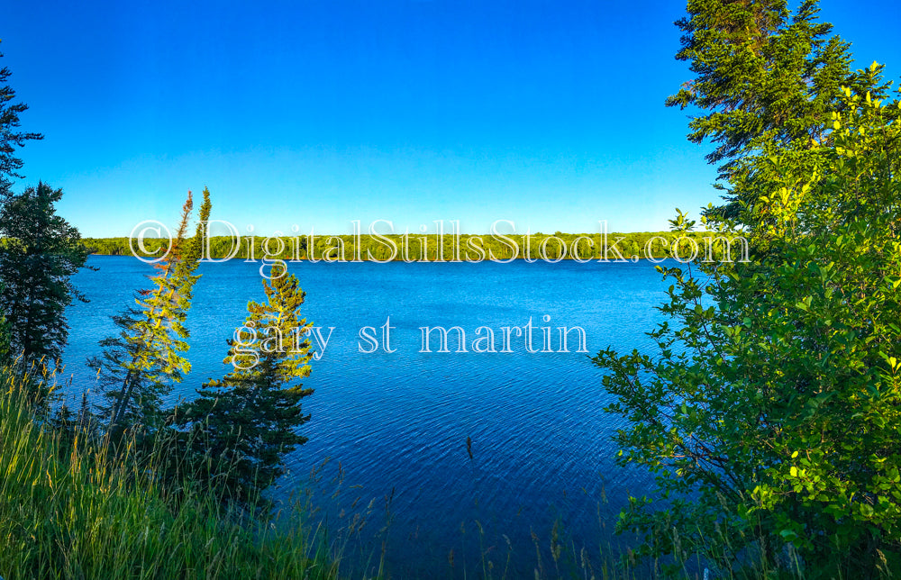 Wide view of the sun shining on the lake, digital Grand marais