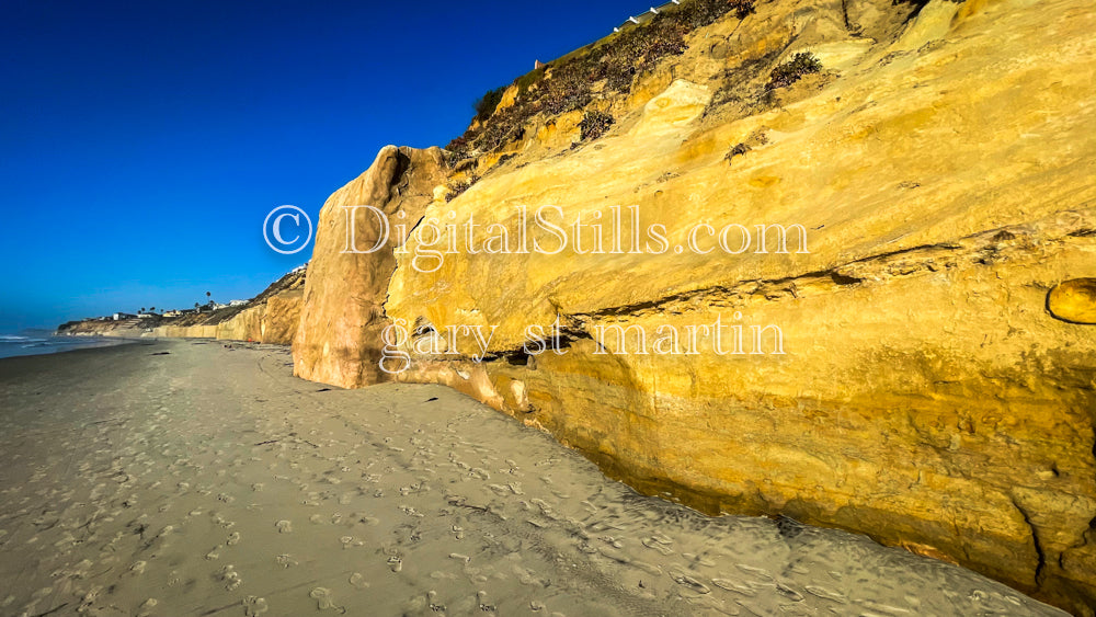 Cliffs along the sand, digital sunset