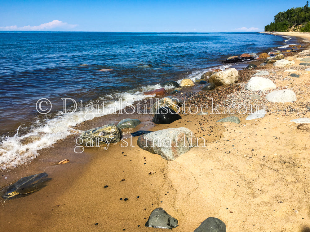 Waves washing over the large beach rocks, digital Grand Marais