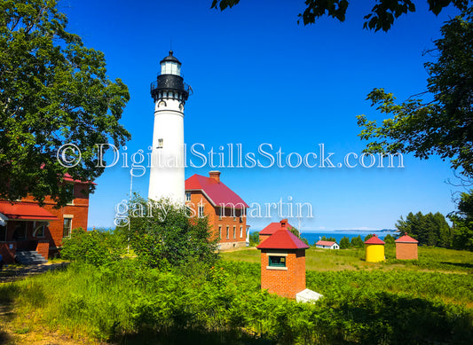 Sable Lighthouse surrounded by buildings, digital Grand Marais