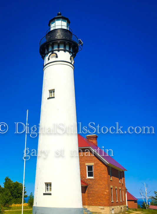 Sable Lighthouse against the bright blue sky, digital Grand Marais