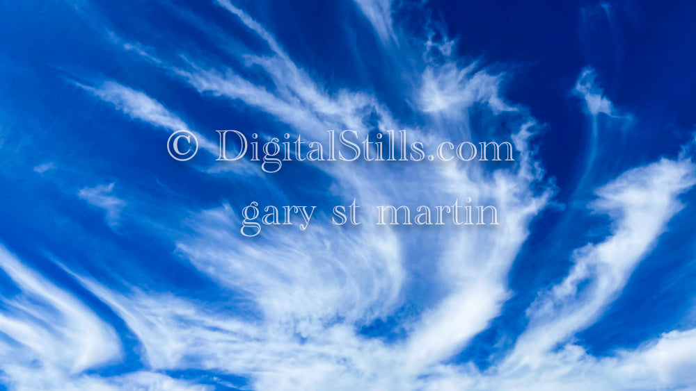 Wispy clouds in the blue sky, digital sunset