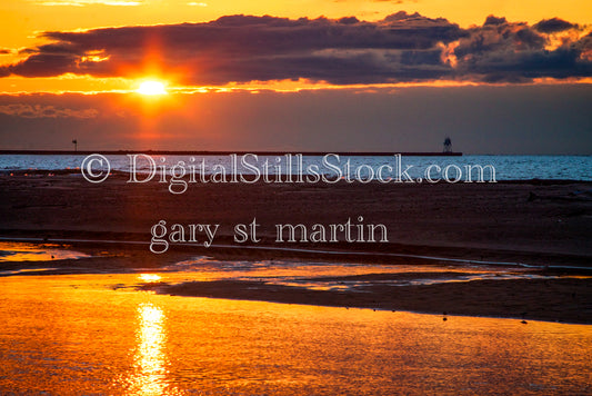 Closeup of a bright orange sunset on the shore, digital Grand mArais