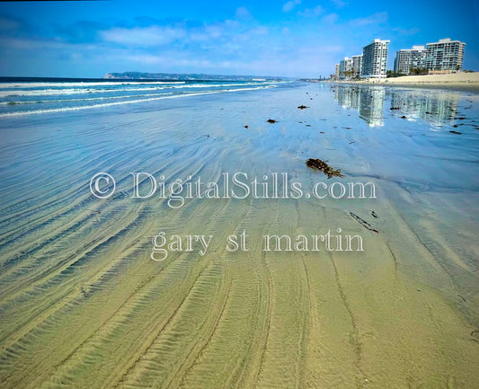 Beach down the shore from skyrises, digital sunset