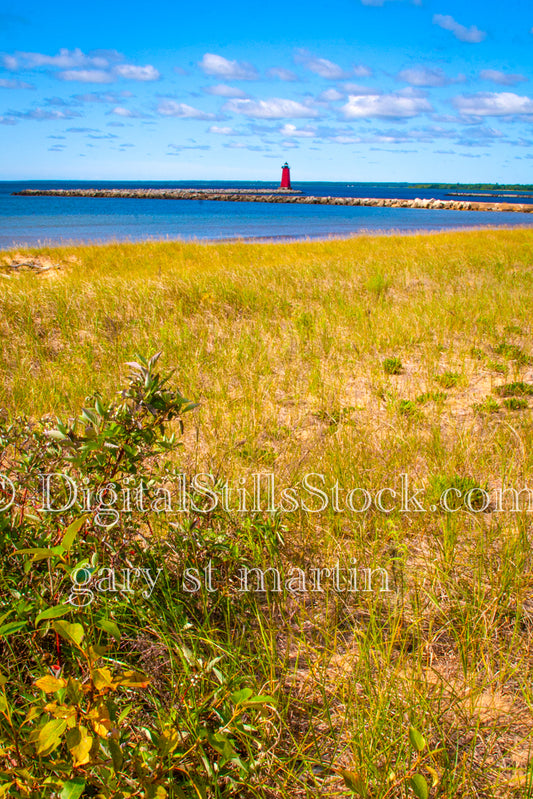 View of the Lighthouse from a field of grass, digital Marinette Lighthouse