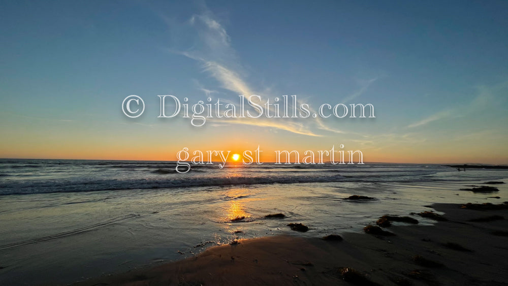 Wide angle of a sun setting on the beach