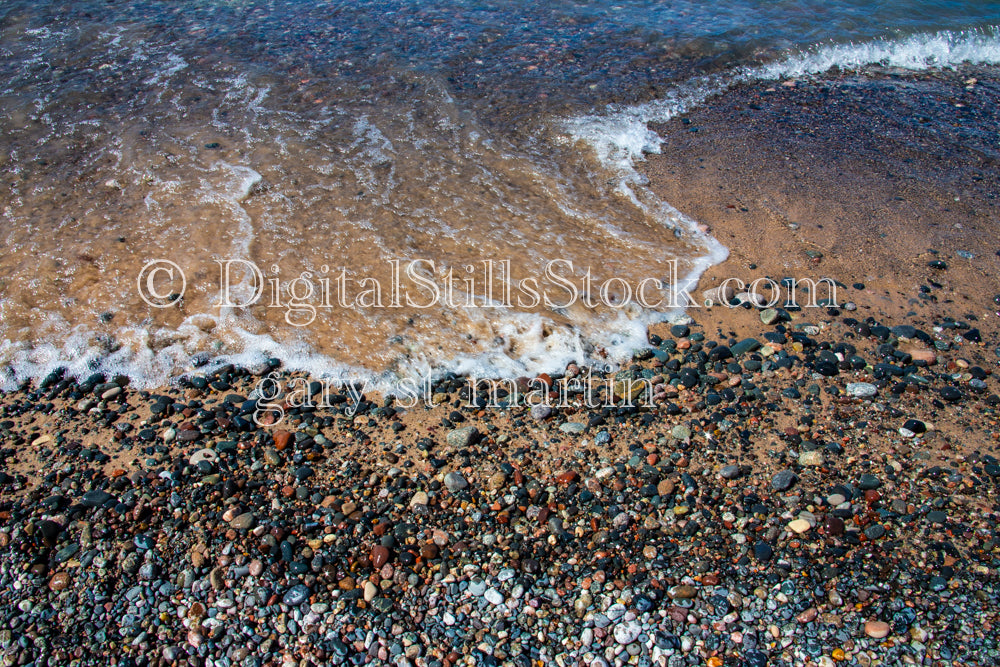 Water washing up on the shore up close, digital Grand Marais